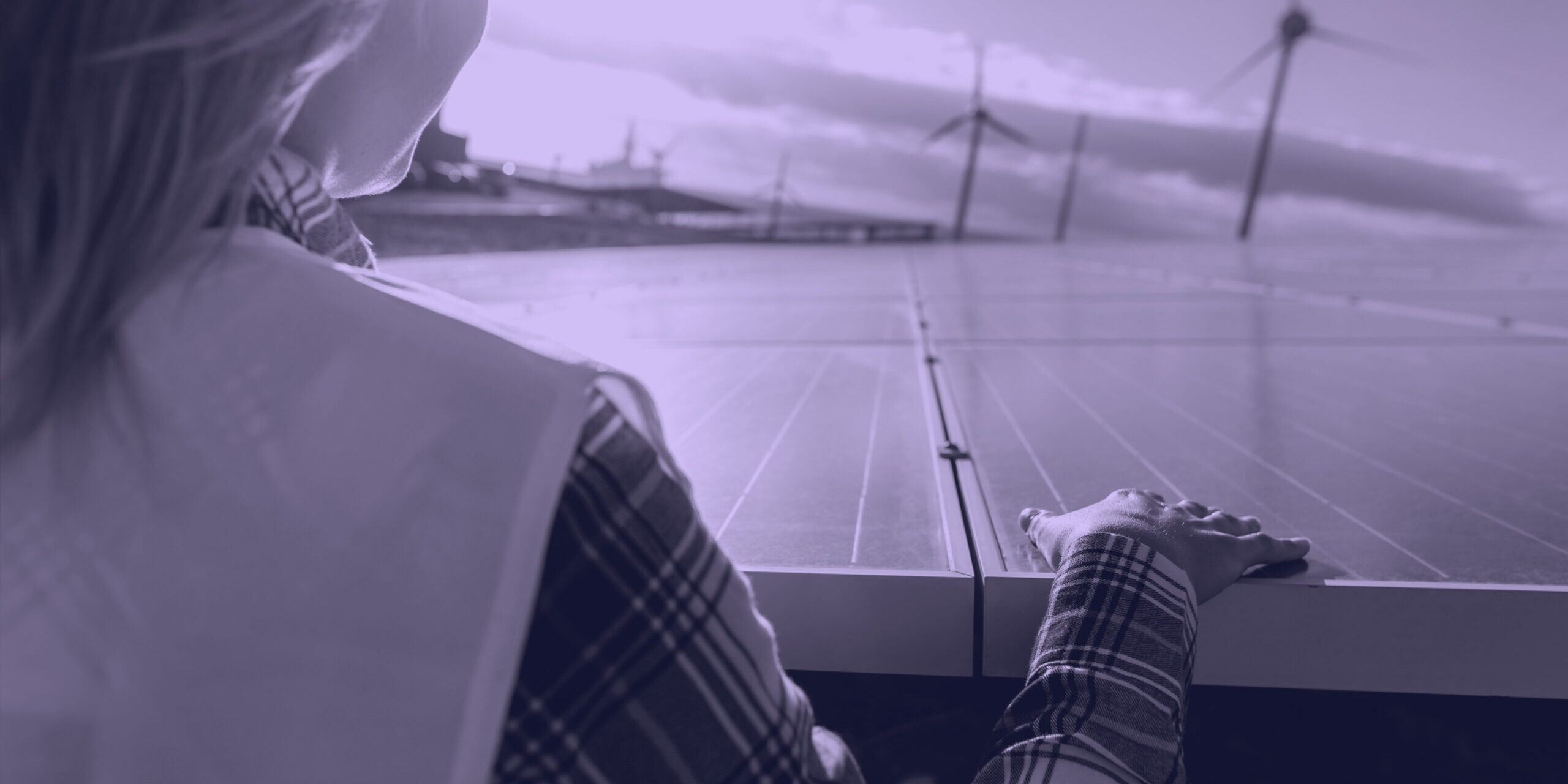 Young female engineer working for alternative energy with wind t